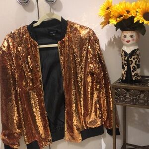 Sequined jacket.  Glam up for the holidays and special occasions or just for fun
